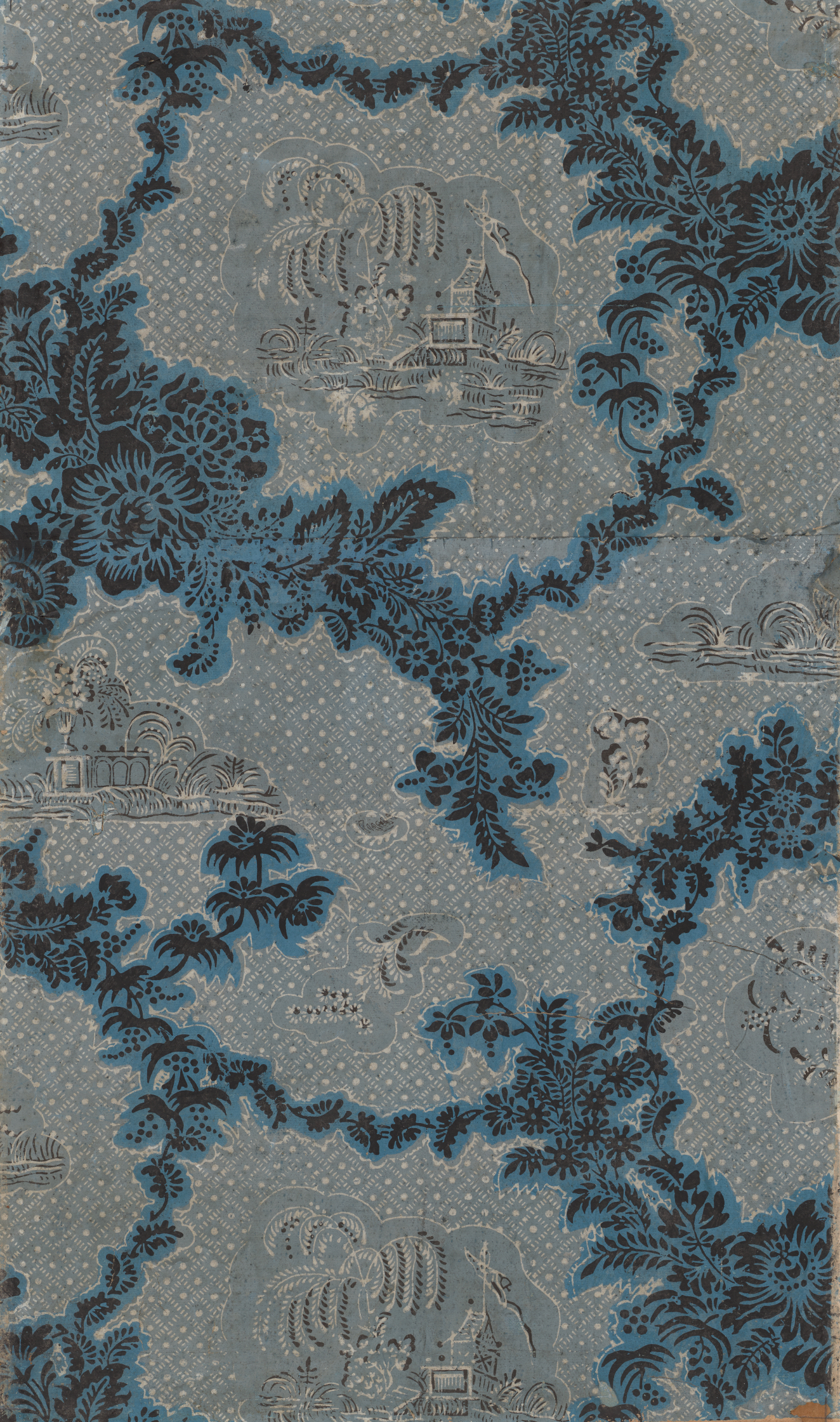 Repeating decorative print of white outlined buildings and trees against a white-dotted light blue background. Black and blue floral motifs sit overtop the dotted background and surround the outlined buildings.