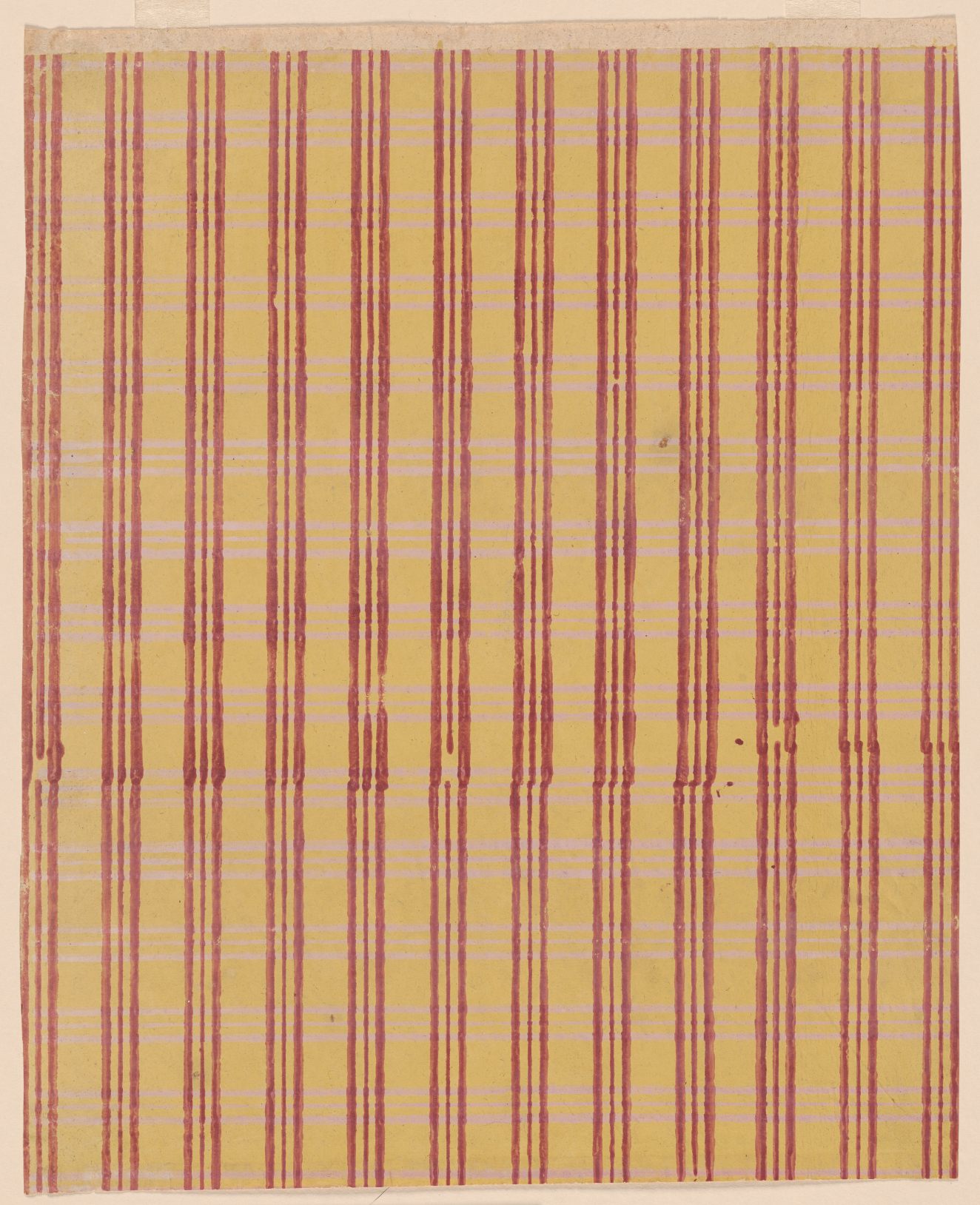 Tan, striped sheet with three, thin repeating vertical red lines and alternating thick and thin repeating horizontal yellow lines. In the middle, the red lines are slightly off center.