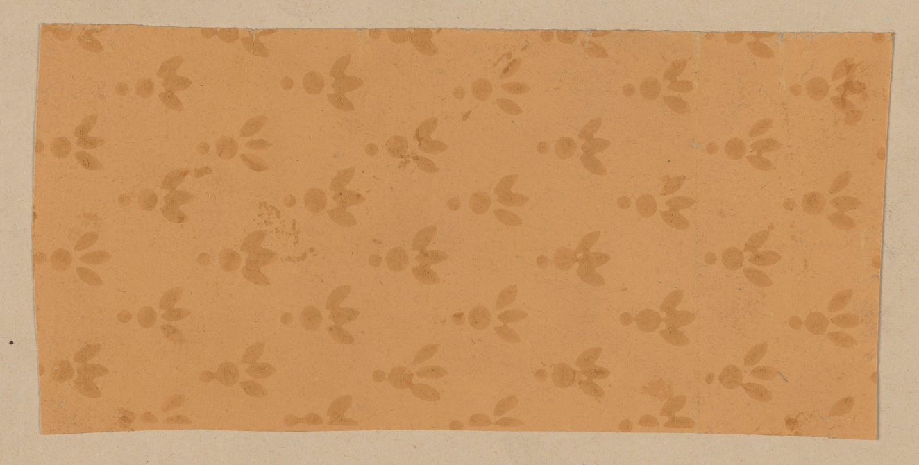 Beige decorative design featuring evenly spaced rows of subtle floral elements with a central circle, three leaves extending to the right, and a dot to the left.