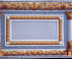 Gilded decorative border with swirling acanthus leaves framing a light blue-gray rectangular panel. The panel is flanked by Corinthian columns, also adorned with acanthus leaves, on both sides.