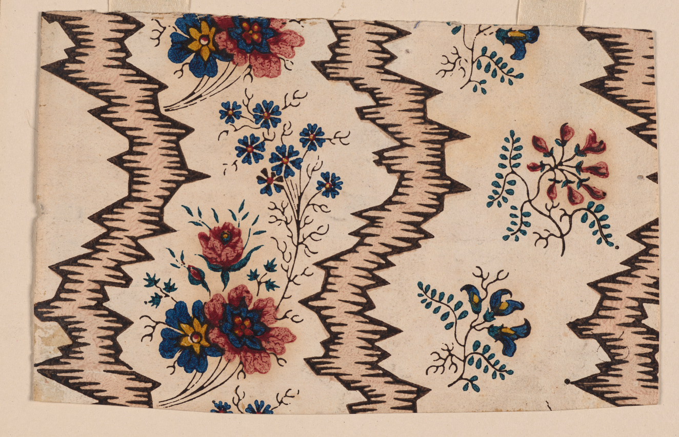 Cream wallpaper with repeating jagged brown vertical lines with horizontal brown lines. In between the stripes are repeating blue, pink, and yellow multicolored flowers on thin brown branches.