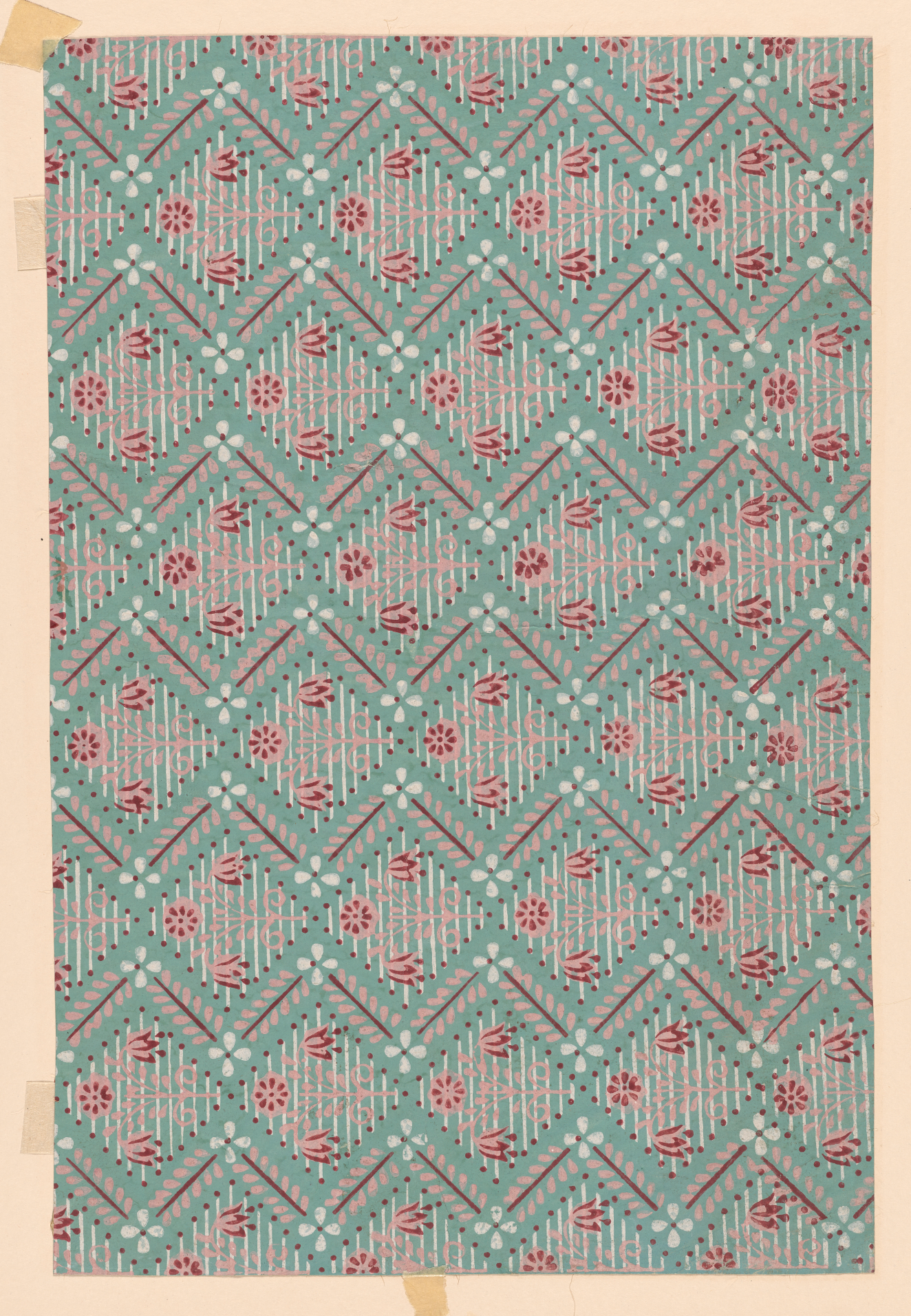 Tan bordered, turquoise wallpaper with pink leaves and white flowers surrounding repeating diamond shaped pockets made out of short, white vertical lines and three pink flowers on the left side.