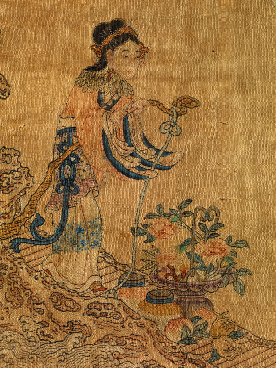 Detail of the scroll showing a robed woman holding a stick-like contraption over a potted plant. She walks on a striped pathway.