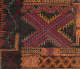 Detail of intricate geometric embroidery on dark fabric showing repeating zigzags and diamond patterns in tones of orange, red, yellow, purple and turquoise surrounding a large purple and red X-shape. 