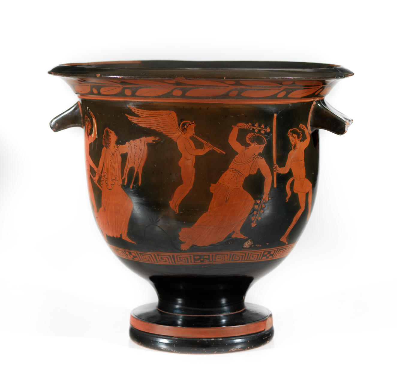 Black vessel with a wide entrance and two short handles whose surface is decorated by an orange scene of figures engaged in ritual dancing and music framed by geometric patterns.