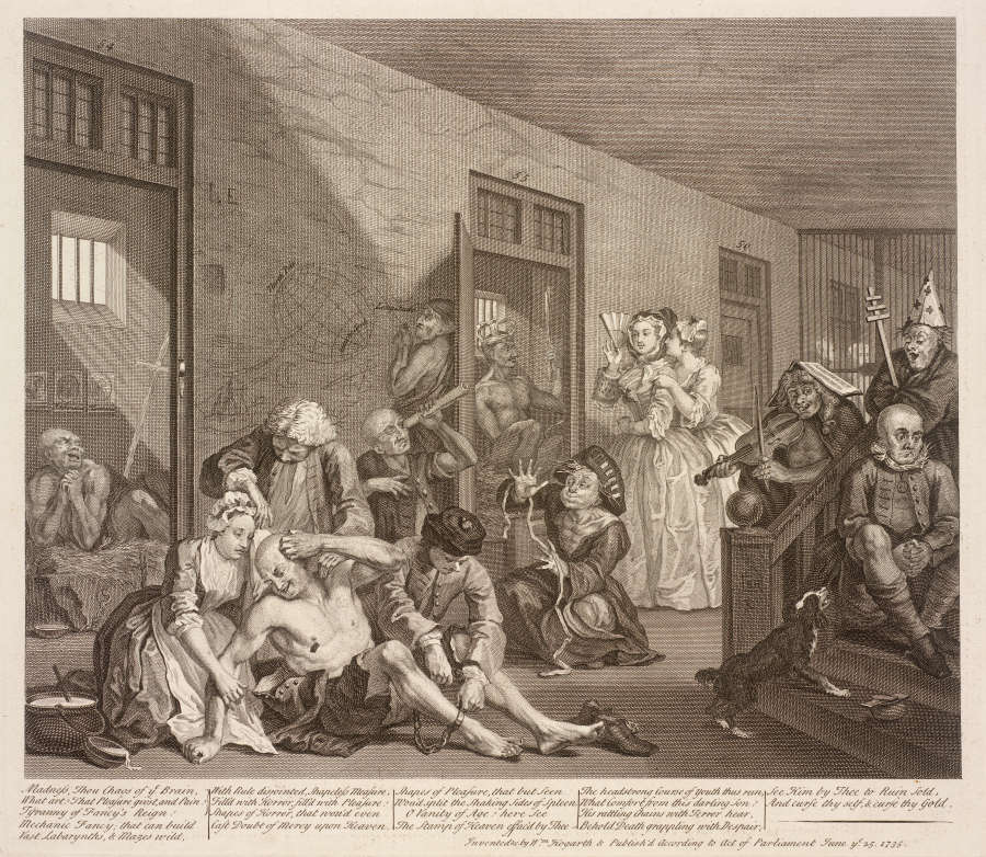 Realistically rendered etching of a cast of characters inhabiting an 18th-century mental institution. The room is populated with institutionalized men, while two upper-class women shield their eyes with fans.