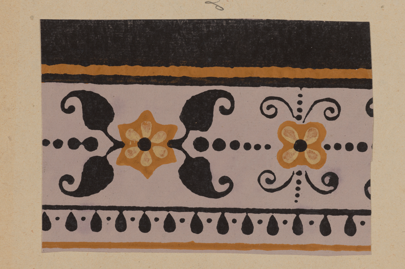 Horizontal decorative border on a neutral backdrop depicting yellow flowers surrounded by black symmetrical leaves and dots with a top black section bordered by black detailing  on a white background.