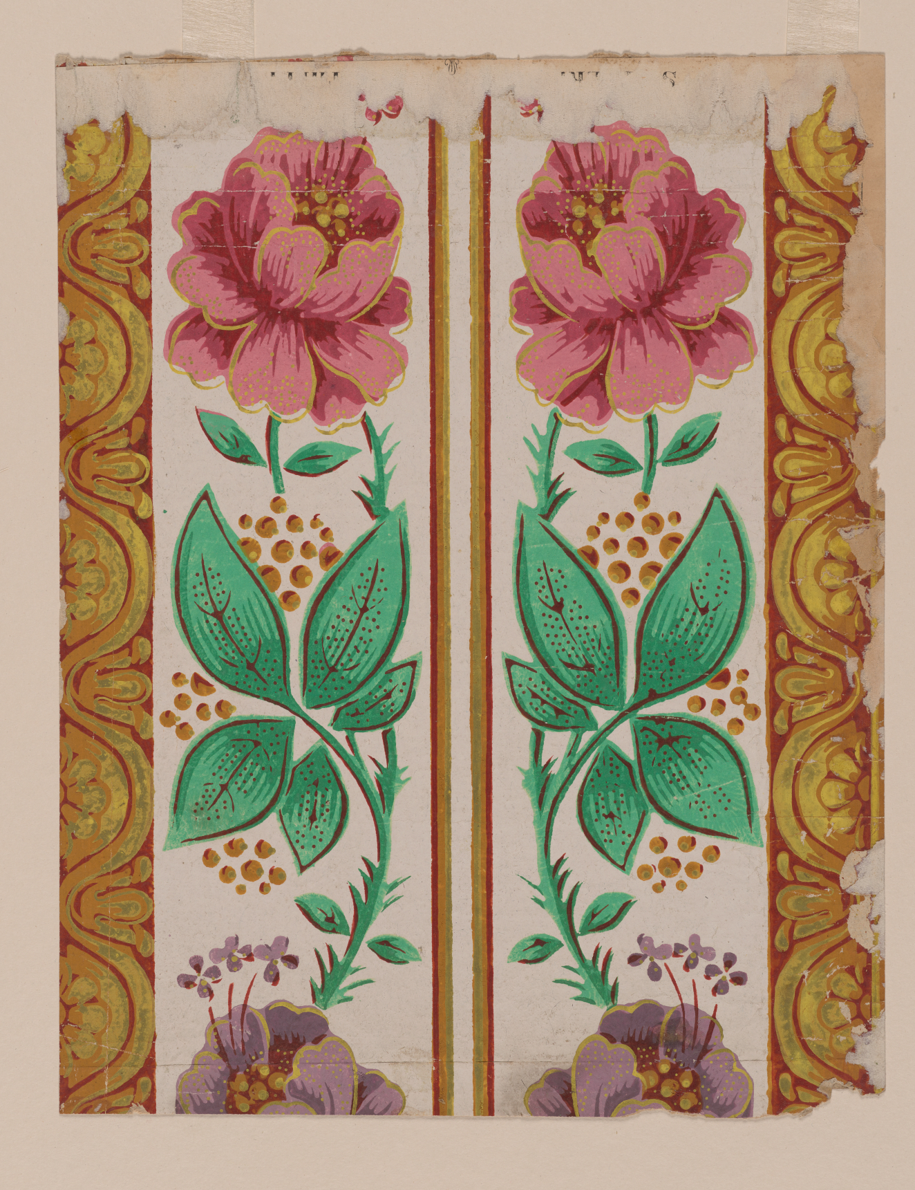 Two pink flowers with green stalks and yellow dots reflected vertically, with smaller purple blossoms below. Split by two thin yellow stripes and bordered by yellow bands with scroll ornamentation.
