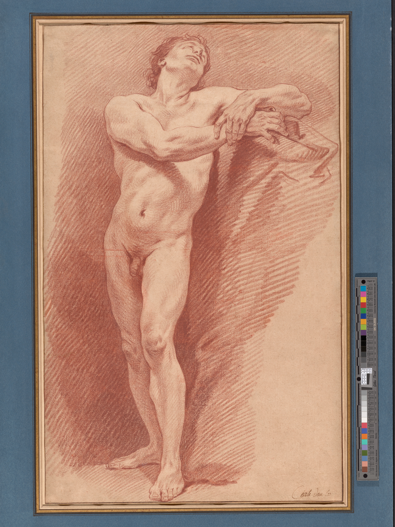 Red chalk drawing of a male nude. With elbow atop a tall draped pillar, he clasps his right wrist with his left hand, tipping his head back to gaze upwards.