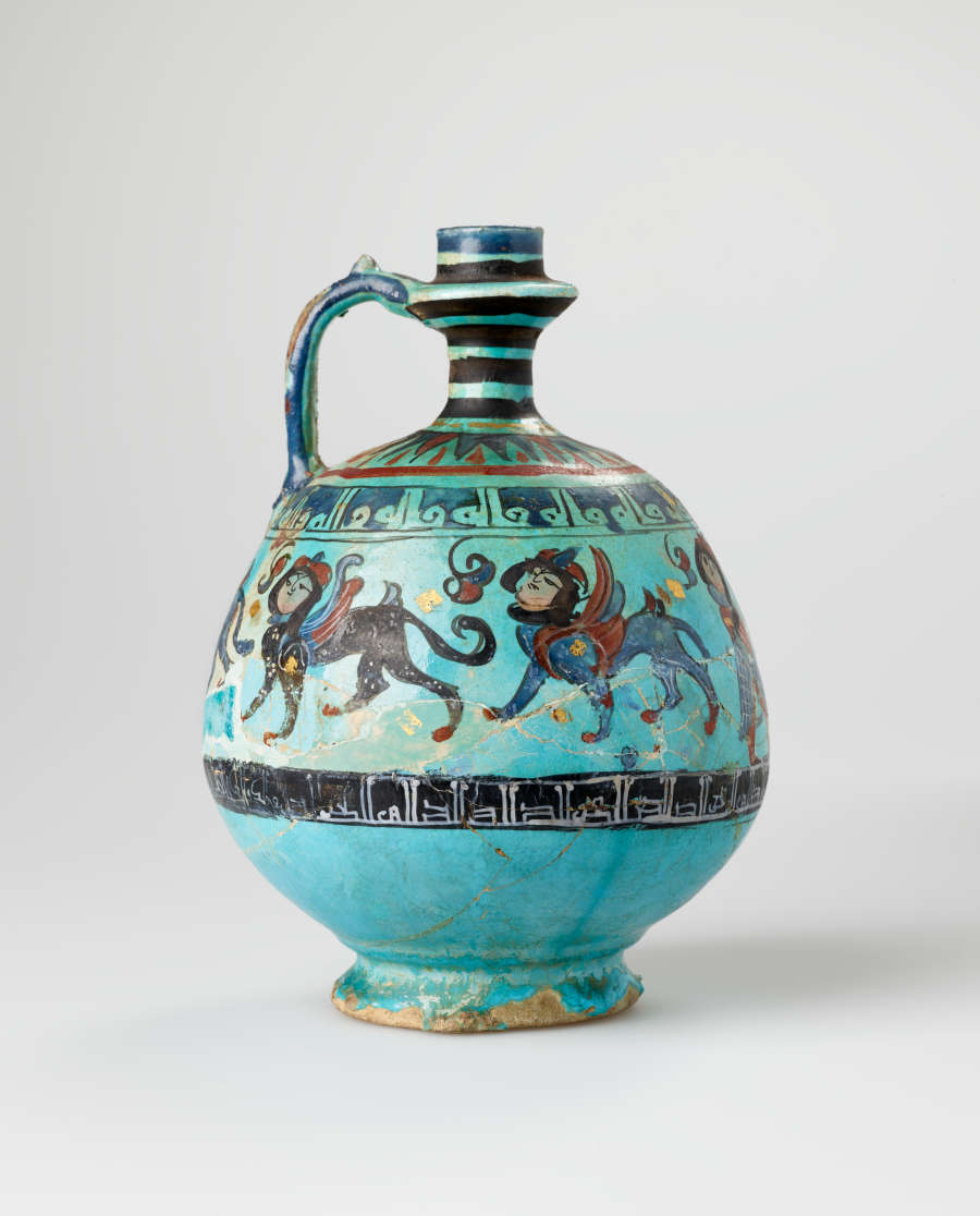 Bright turquoise jug with a spherical body and slender striped neck and handle. The jug’s body is decorated with illustrations of winged humanoid four-legged creatures and dark patterned stripes.