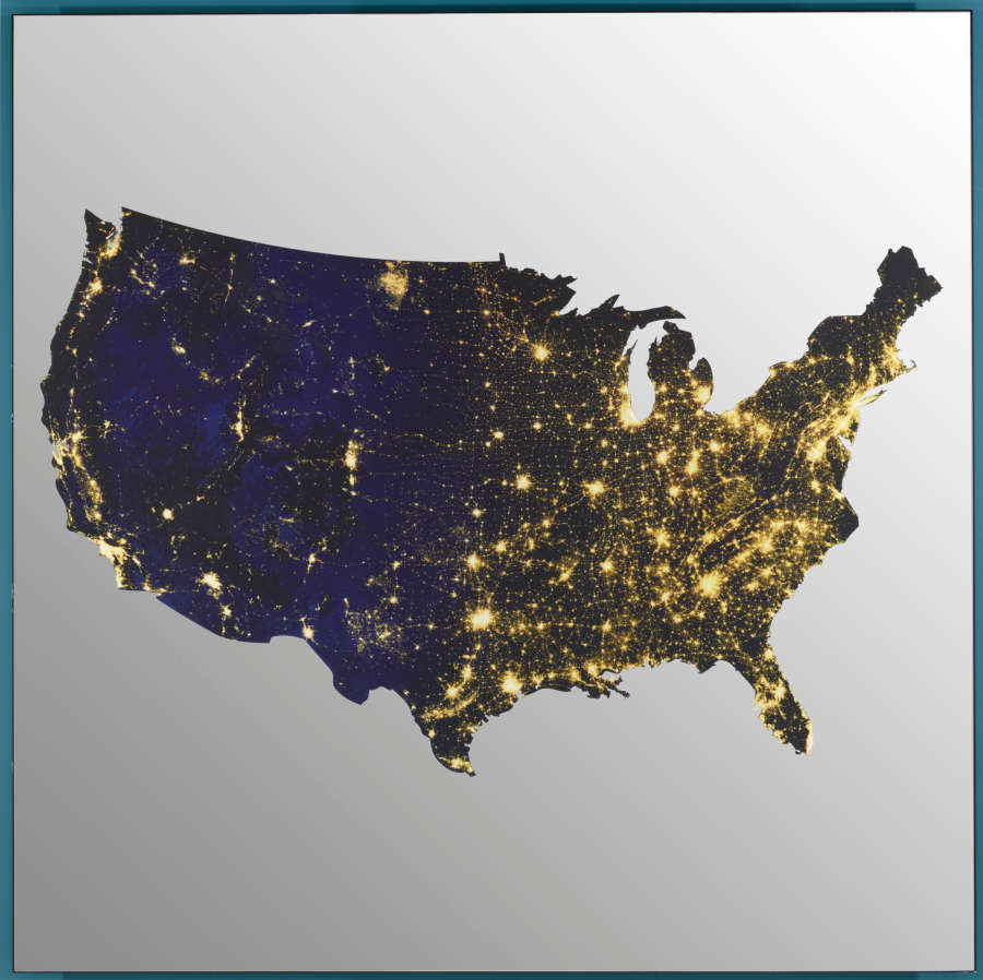 Map of the United States depicting population density through the use of bright clusters of light to represent dense cities. The areas left unilluminated represent rural areas.