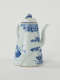 A white and blue teapot with floral decorations, a lid with a small semi spherical finial, spout, and a handle which is located approximately 90 degrees from the spout.