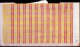 Tan, striped wallpaper with jagged edges, a white sticker with “249” in black text, handwritten text that reads “34.1112 dye,” and three red lines repeated vertically, and multiple yellow lines repeated horizontally.