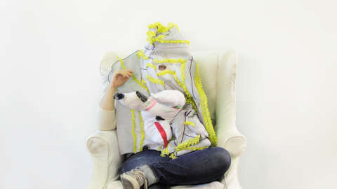 artist in chair in costume