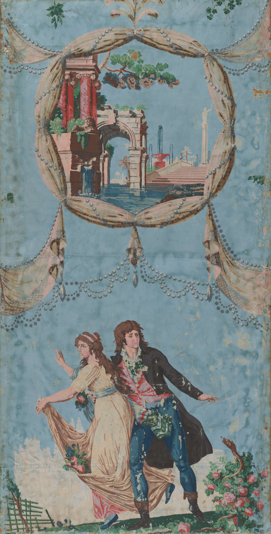 Aged, light blue wallpaper of two well-dressed figures in mid flight within a garden. Above them is an architectural scene framed in beaded white fabric that extends above and below.