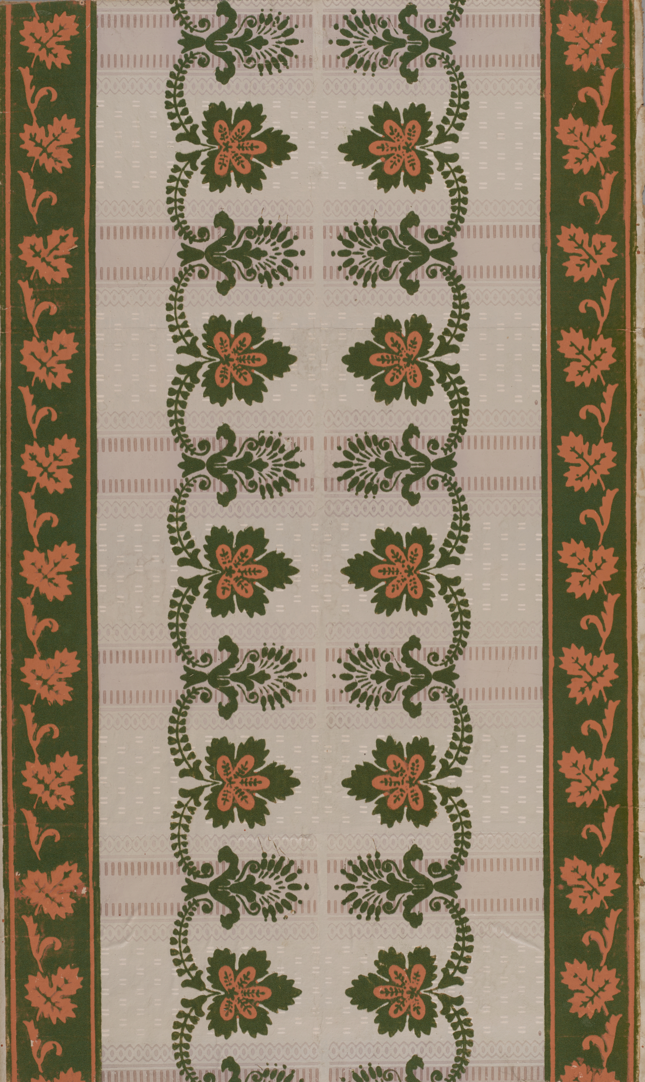 Wallpaper with a pink and green floral border and two repeating, winding vines with green bordered pink leaves and green dotted geometric shapes, atop a plaid gray pattern underneath.