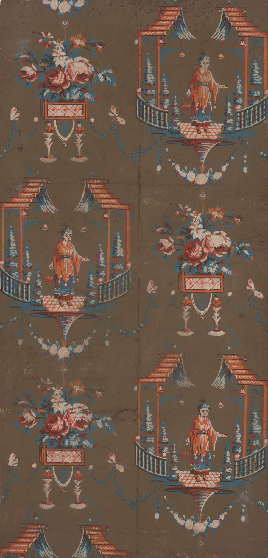 Narrow panel of vintage wallpaper featuring a pattern of figures in pagodas wearing traditional orange robes. The design is accented with ornamental shapes and set against a brown-gray background.