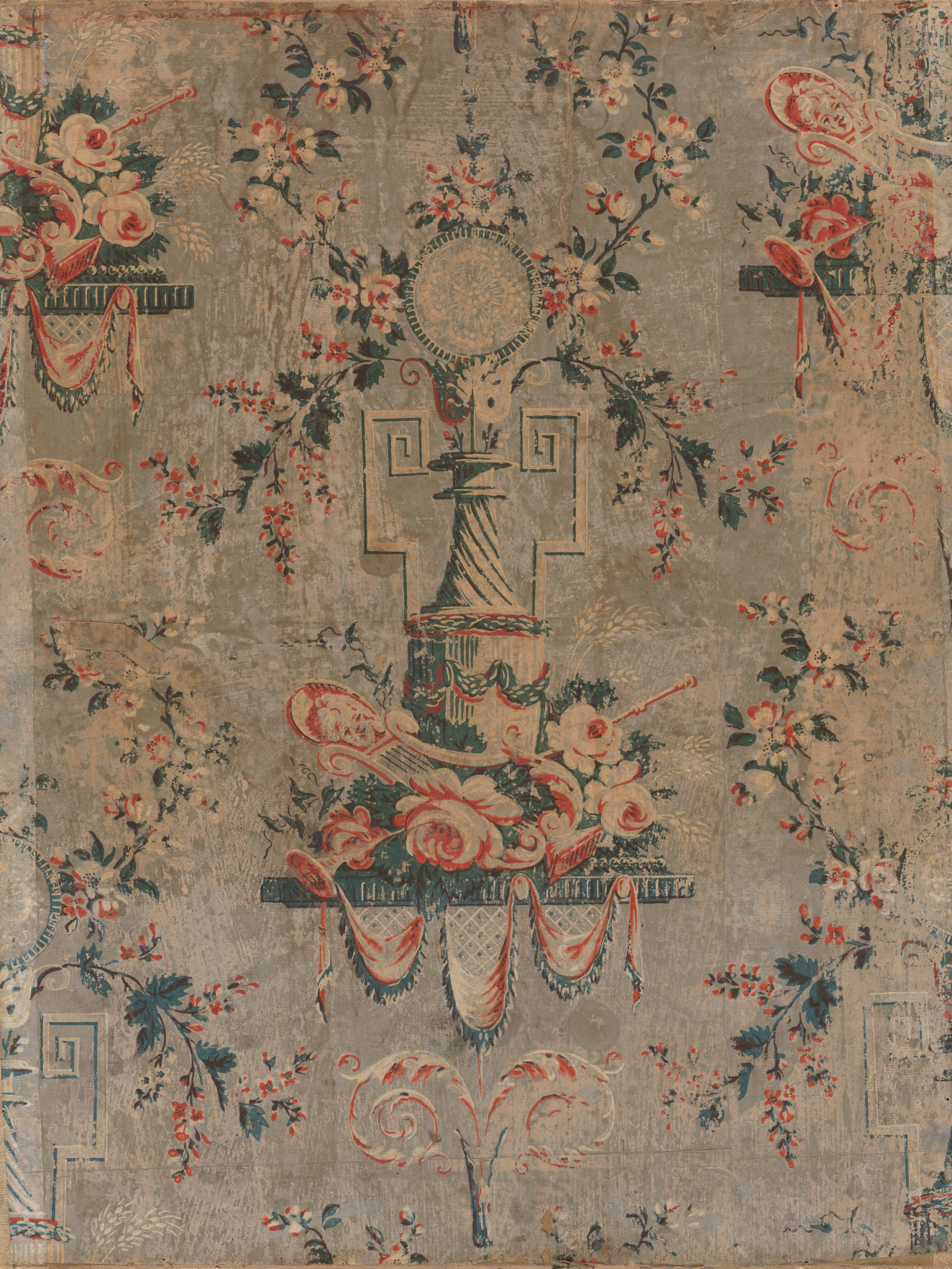 Weathered print of red and white flower garlands surrounding a lined center pillar which holds a circular pendant above. Instruments, flowers, and draping fabric are at the object’s base.
