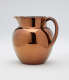 A bronze-colored jug.
