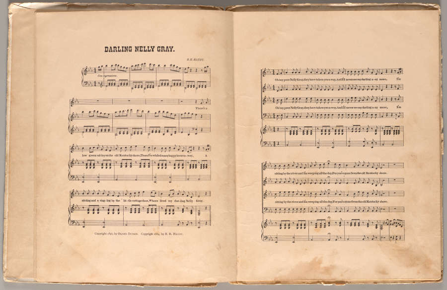 An aged open book with a musical composition with the title of “DARLING NELLY GRAY”.