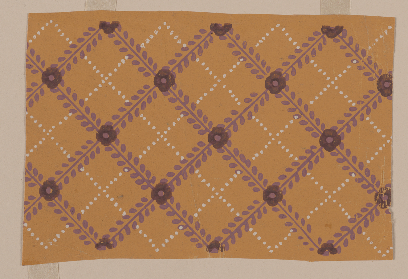 Horizontal decorative design featuring a diagonal grid made up of purple stems accented by darker flowers intersected by a thinner white dotted grid on a mustard yellow background.