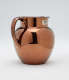 A bronze-colored jug.
