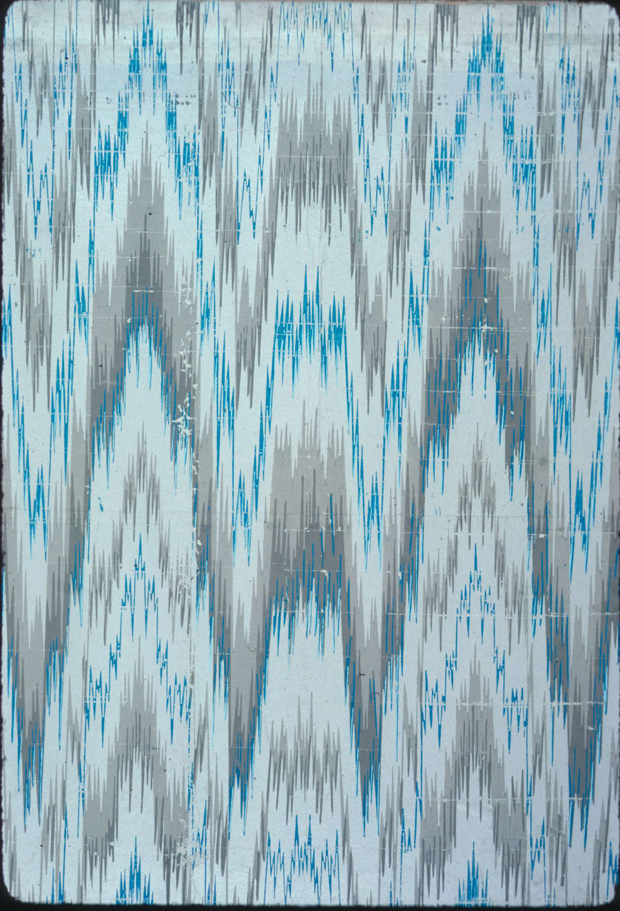 Scuffed wallpaper with multiple turquoise and brown-toned  jagged zigzag lines layered and repeated on top of a muted background.