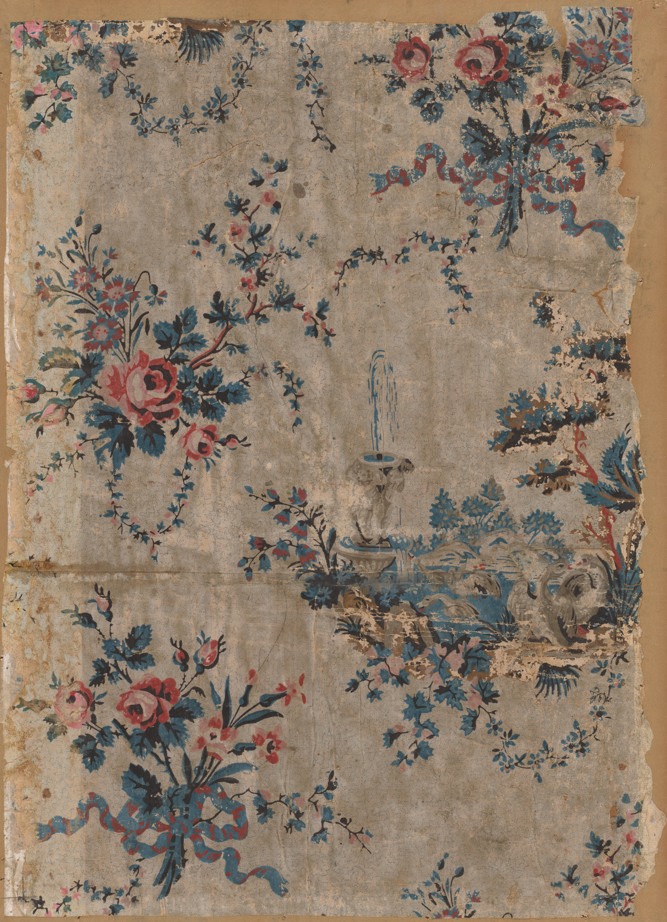 Ripped and weathered wallpaper containing repeating motifs of a fountain next to birds in the water and blue ribbons wrapped around various sized groups of stemmed pink flowers and garlands.