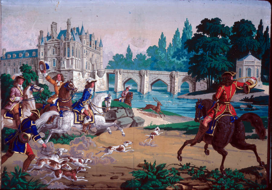 Lively print of unleashed dogs and six well dressed figures, five on horseback and one with multiple leashed dogs, speedily coming towards a deer running shoreside. A large castle with a bridge and gazebo are in the distance.