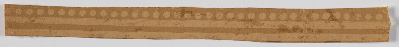 Horizontal strip in shades of tan on a white backdrop. Features a light colored row of dots above two horizontal lines.