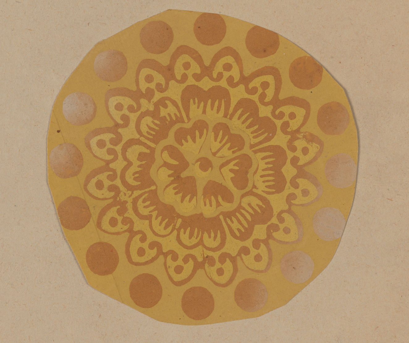 Golden ornamental motif on a neutral backdrop featuring a layered central floral design bordered by alternating darker and lighter circles.
