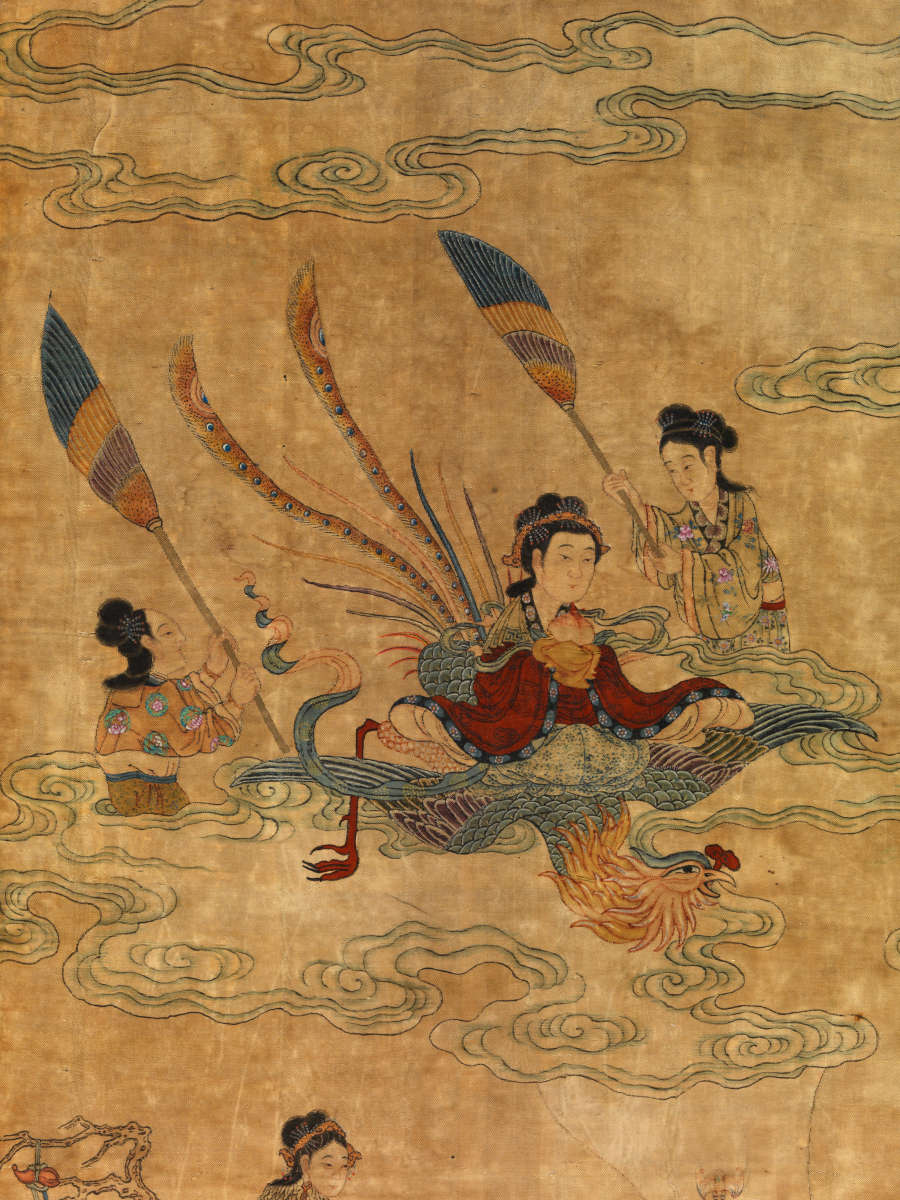 Scroll detail, showing a figure sitting on top of a bird and flanked by two other figures who hold up broom-like devices, resting on clouds. The bird is upside-down.