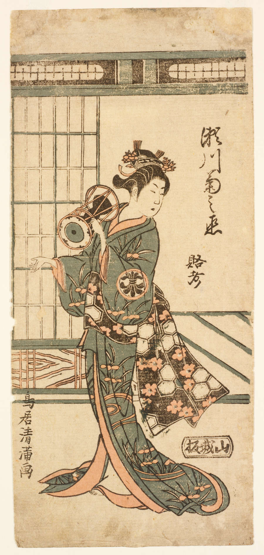 A muted red and green colored woodblock print of a Japanese actor playing a small hand drum. He is depicted in a room with a half-opened sliding door behind him.