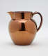 A bronze-colored jug.
