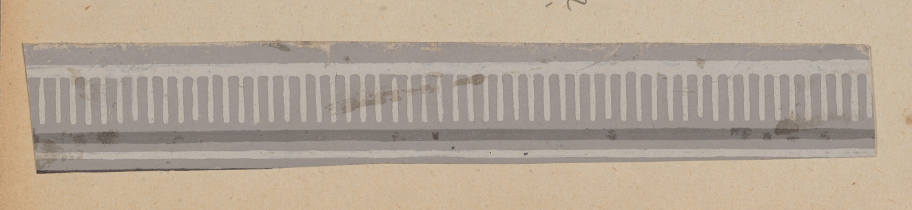 A horizontal strip with thin white stripes on a gray background.