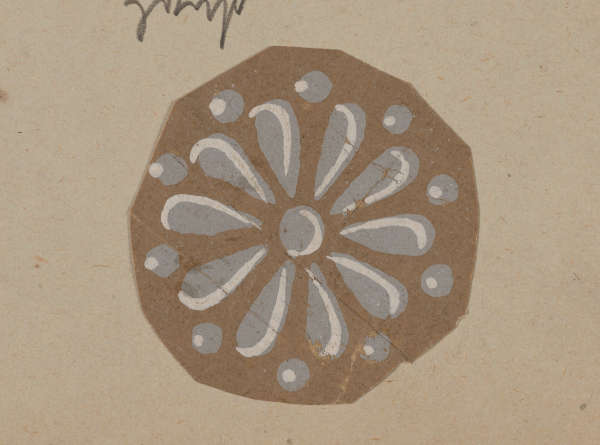 A decorative grey floral pattern featuring teardrop petals radiating from the center accented with dots between the petals, set on a brown background.