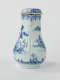 A white chocolate pot with blue decorations depicting floral and architectural elements.