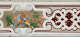 Border fragment with a colorful center frame depicting a human figure upon an arched form, framed by white scroll designs and dark red florals and linework.