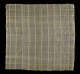 Square of transparent woven fabric on a dark background with a grid of yellow and green stripes whose colors slightly vibrate. The surface is soft and slightly wrinkled.