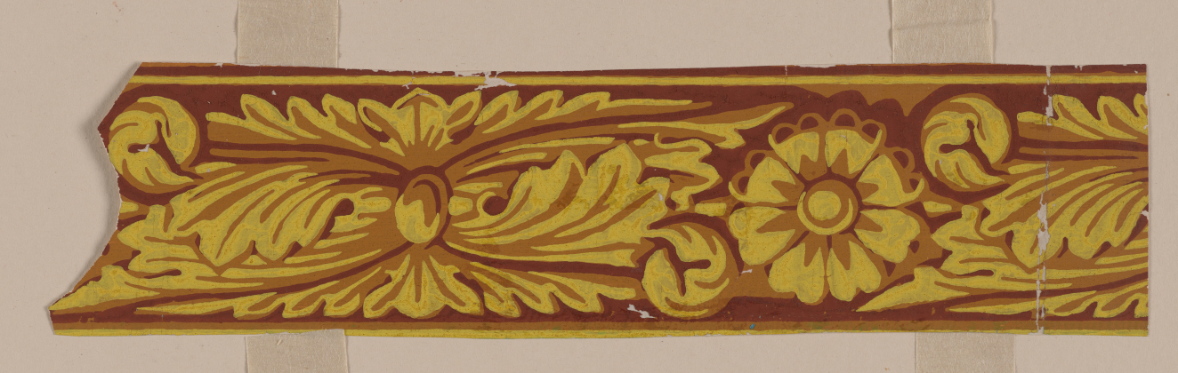 Decorative border design on a neutral background in warm browns and yellows. Features swirling leaf patterns alternating with central flowers that are intricately shaded.