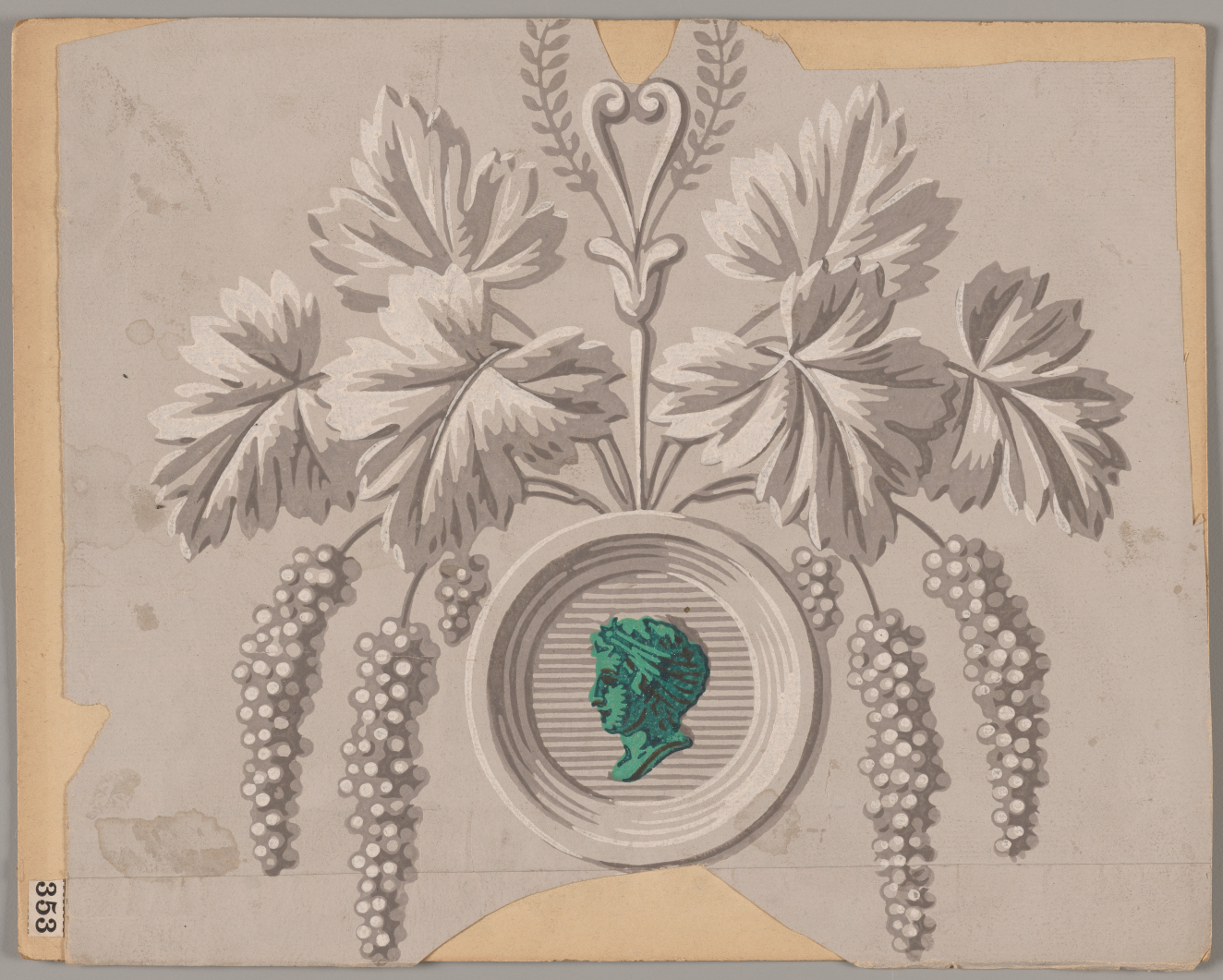 Ornamental silver design with a gray backdrop depicting intricately shaded leaves and clusters of berries sprouting from an engraved medallion with a green profile portrait in the center.
