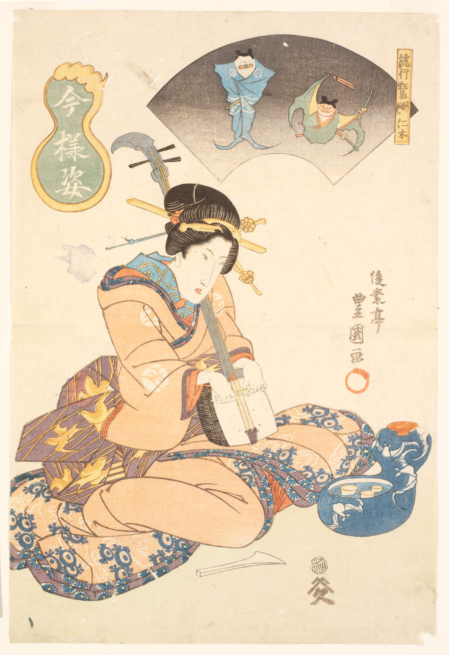 A woodblock print in muted tones. A seated woman in a patterned robe plays a three-stringed musical instrument. Above, in a fan-shaped frame, are two bats dressed as samurai.
