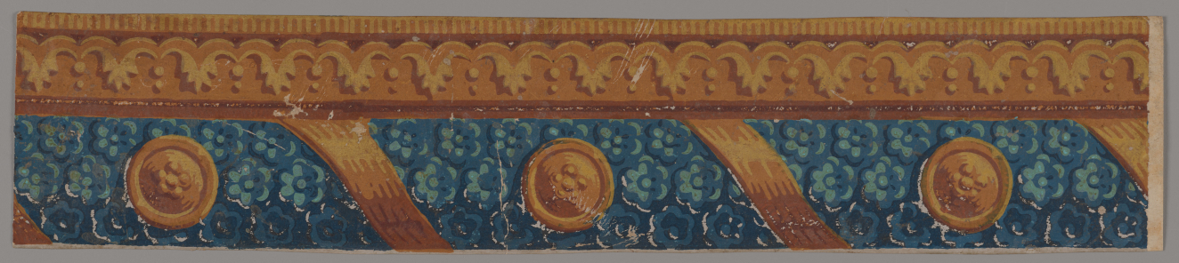 A thin gold top layer with leafy arches sitting upon a wider blue floral section interspersed with diagonal gold bands and gold emblems with florals.