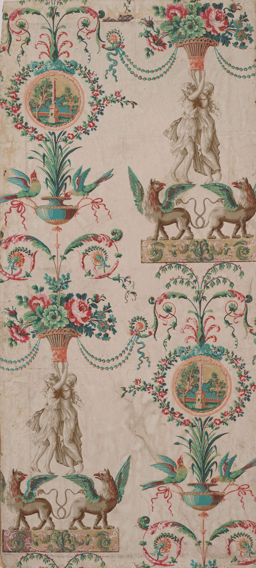 Tan wallpaper with repeating motifs of mythological statues standing on winged creatures with interlacing tails, and holding up colorful floral bouquets, which extend upwards to contain birds and landscape pendants.