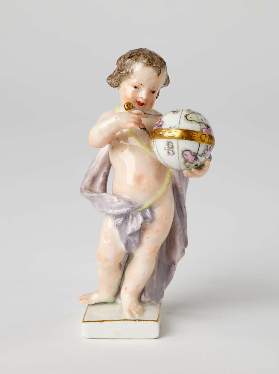 A sculptural putto figure holding a globe banded with gold. The putto has brown hair, red lips, and a light purple fabric draped across their body.