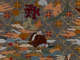 Detail of intricate embroidery depicting a figure in a red robe sitting and looking up in reverence at a Chinese character on a backdrop of dense multicolored clouds and flowers.