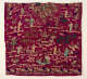The back of a richly embroidered tunic with intricate depictions of figures, birds, plants, and bridges in vibrant colors on a red background."