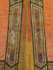 Vertical gold-embroidered green panels frame the robe’s yellow inside lining, featuring mirrored white and blue dragons, stylized wave patterns, and flame-like clouds in red and blue on orange silk.