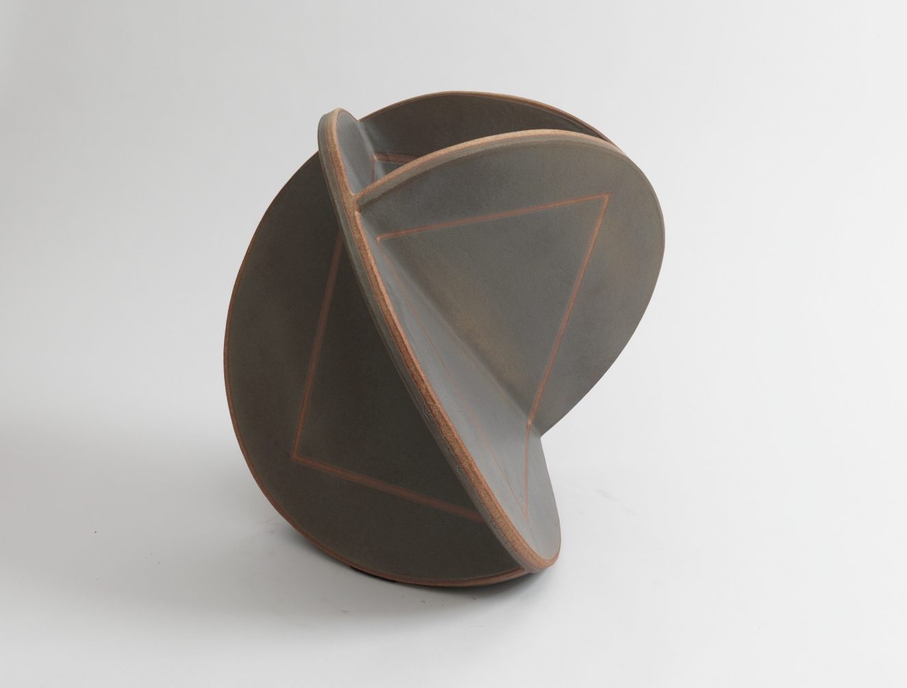 Intersecting matte black ceramic discs forming a partial sphere shape, each disc segment marked with a faint triangular design on the surface and thin reddish-brown rims.