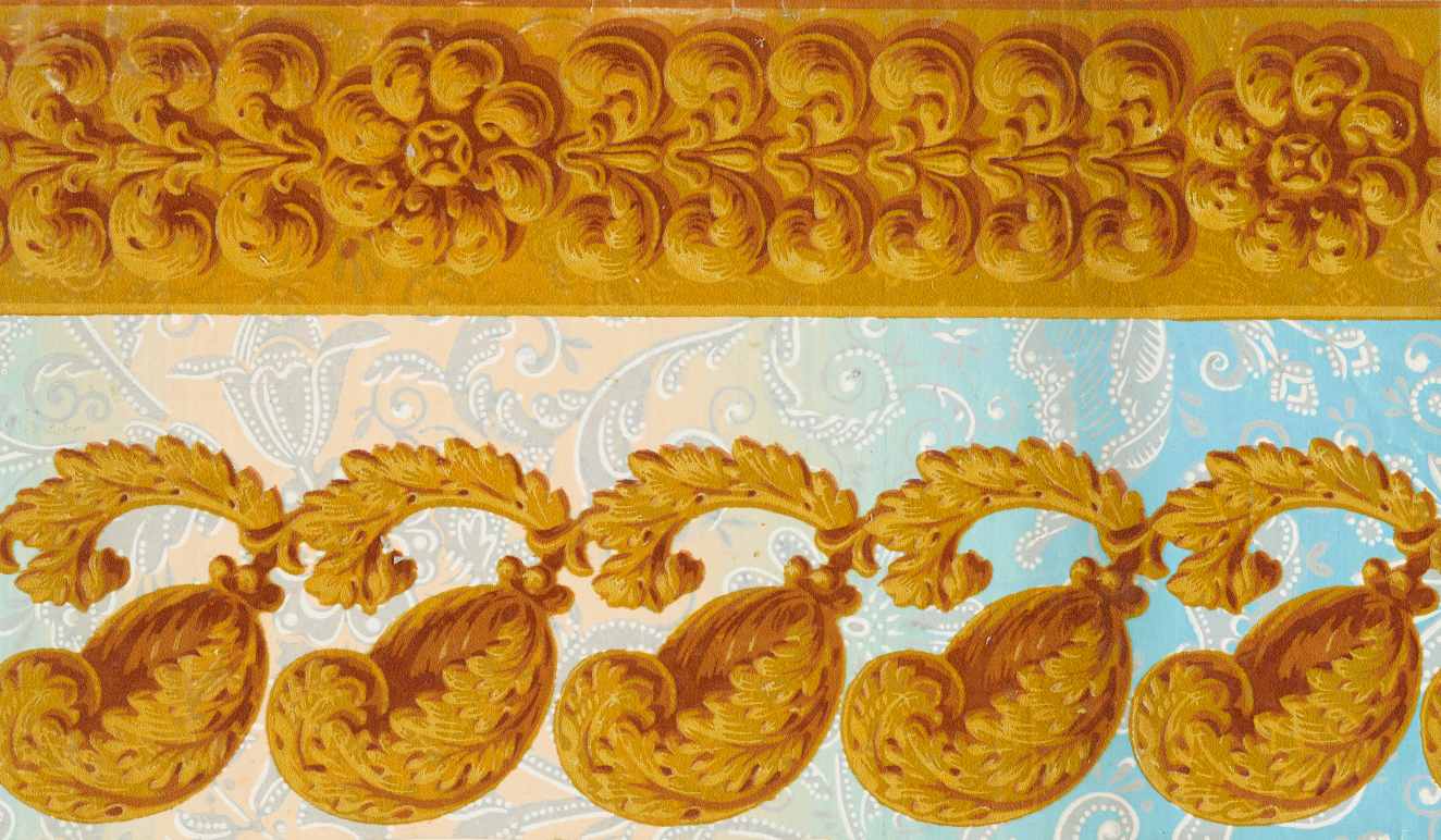 Multicolored, floral wallpaper with large, repeating gold leaves along the bottom and a thick golden top border made out of embellished, repeating flowers and leaves.
